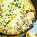 Philly Cheesesteak Dip is a warm, gooey deconstructed version of a sandwich classic. This creamy warm dip recipe is loaded with tender ribeye, fresh green peppers, sweet onions, and melted cheese. Perfect party and game day appetizer.