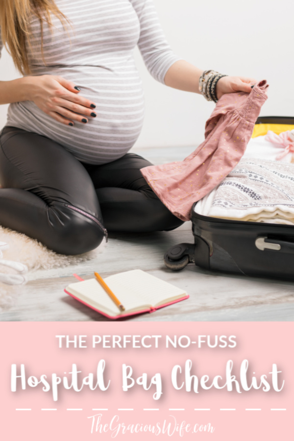 Pregnant mom packing a suitcase with a notebook and a pencil. Text underneath picture reading "The Perfect No-Fuss Hospital Bag Checklist - TheGraciousWife.com"
