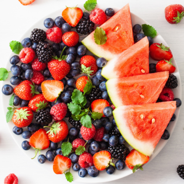 Watermelon and berries in a large bowl with mint