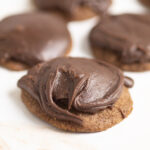 Chocolate Texas Sheet Cake Cookies with chocolate frosting on a white background.